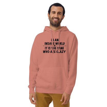 "In an insane world, it is the sane who are crazy" printed on a dusty rose warn by a male