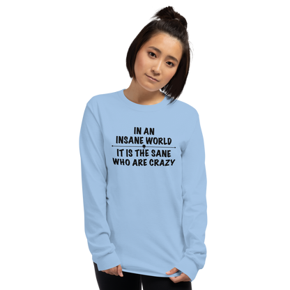 "In an insane world, it is the sane who are crazy" printed on a light blue men's long sleeve shirt worn by a female
