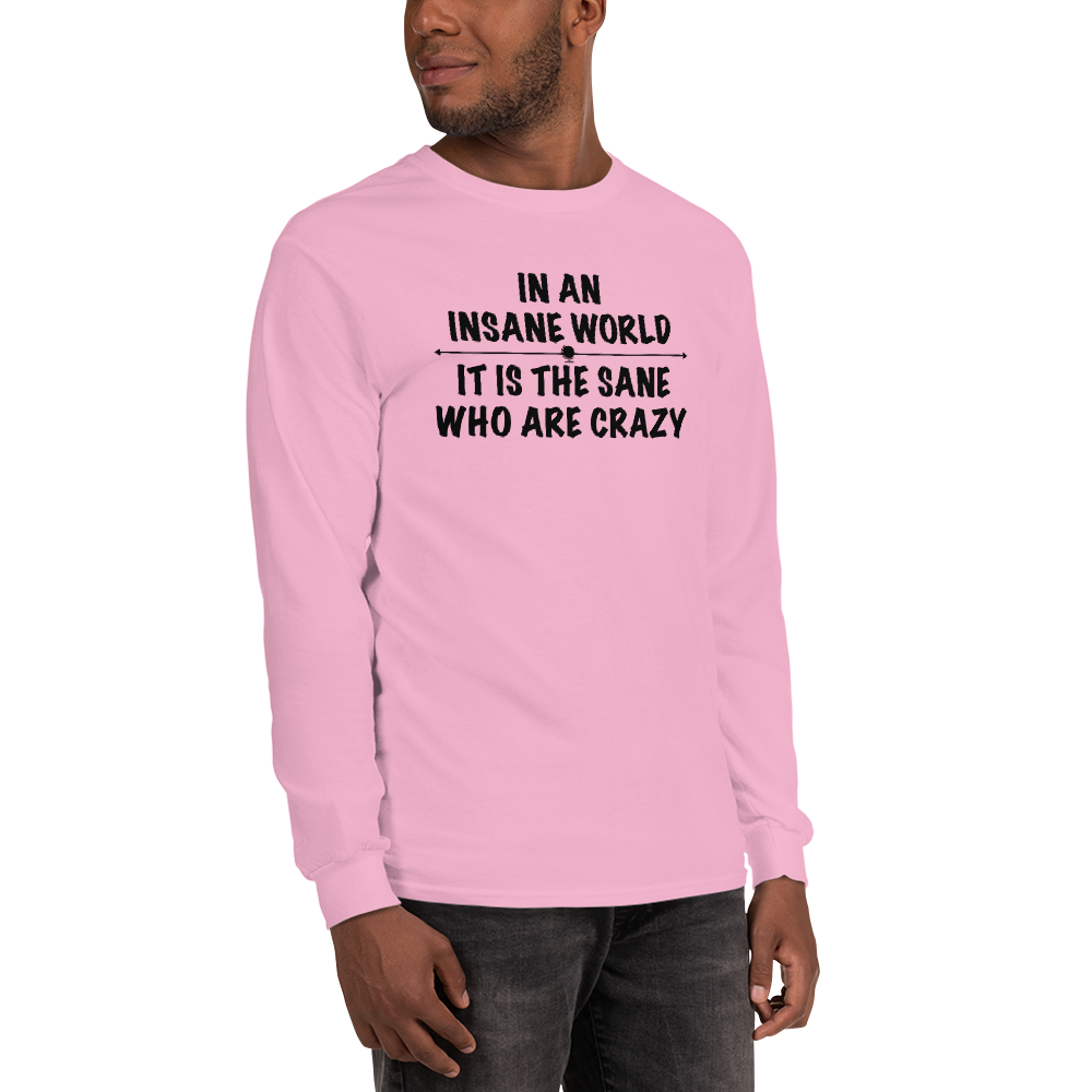 "In an insane world, it is the sane who are crazy" printed on a light pink men's long sleeve shirt worn by a male