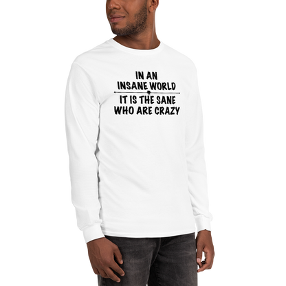 "In an insane world, it is the sane who are crazy" printed on a white men's long sleeve shirt worn by a male