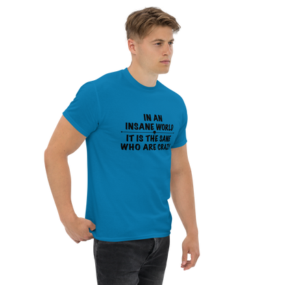 "In an insane world, it is the sane who are crazy" printed on a sapphire unisex classic tee worn by a male