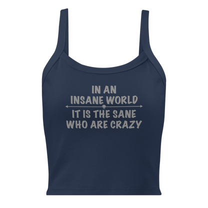 "In an insane world, it is the sane who are crazy" printed on a solid navy blend women's micro-rib tanktop laying on a flat surface