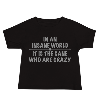 "In an insane world, it is the sane who are crazy" printed on a black baby jersey short sleeve tee laying on a flat surface