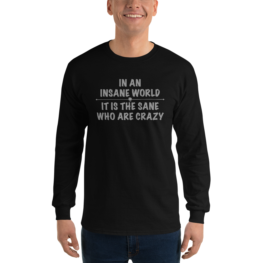 "In an insane world, it is the sane who are crazy" printed on a black men's long sleeve shirt worn by a male