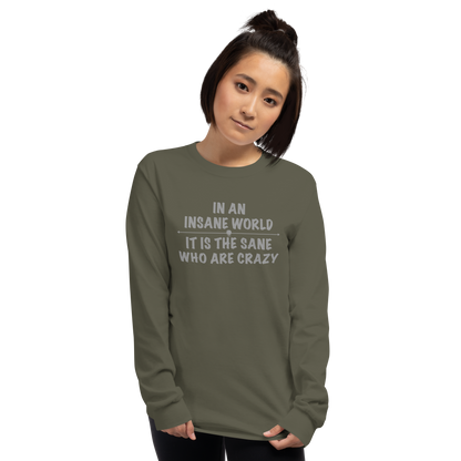 "In an insane world, it is the sane who are crazy" printed on a military green men's long sleeve shirt worn by a female
