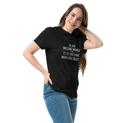 "In an insane world, it is the sane who are crazy" printed on a black unisex classic tee worn by a female