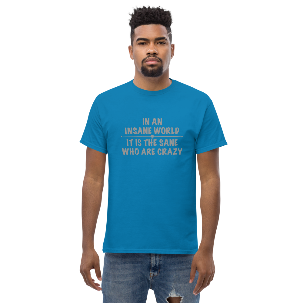 "In an insane world, it is the sane who are crazy" printed on a sapphire unisex classic tee worn by a male