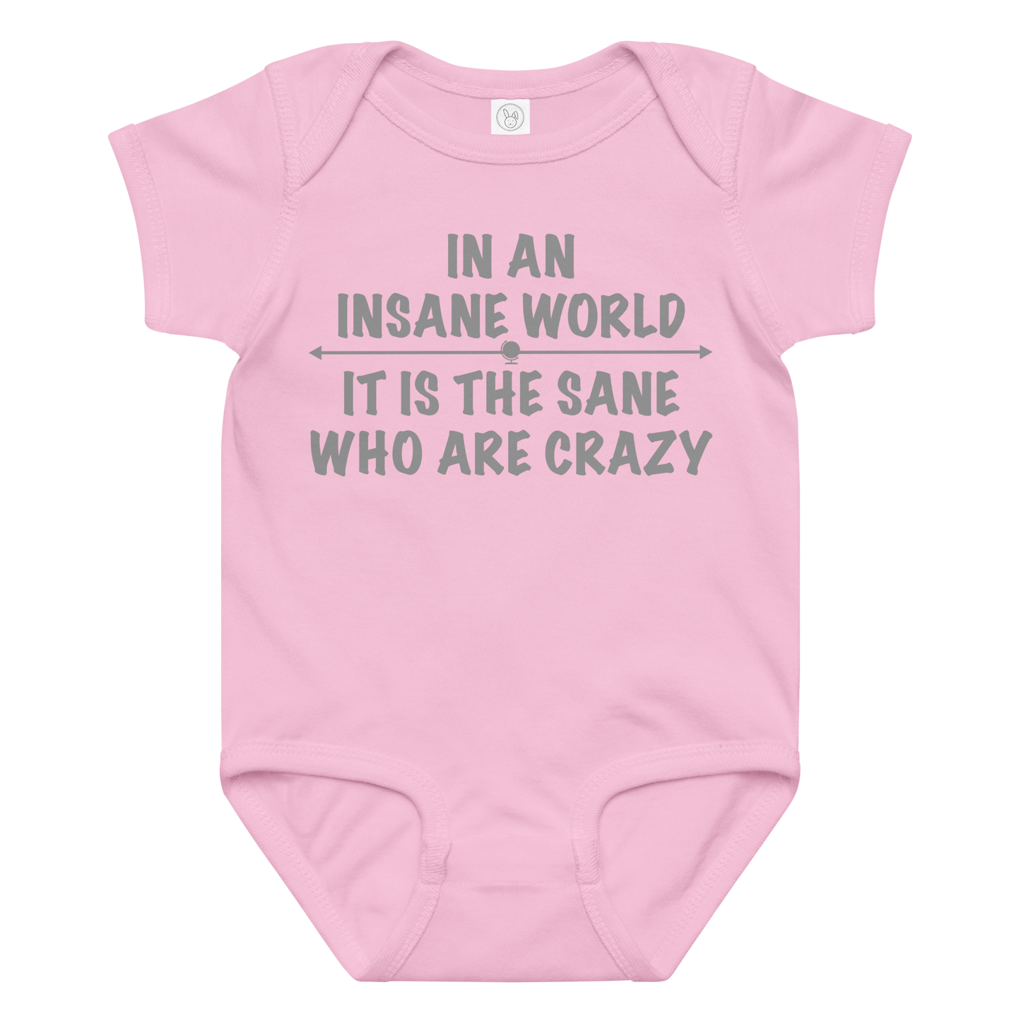 "In an insane world, it is the sane who are crazy" printed on a pink baby jersey bodysuit laying on a flat surface amongst other clothes