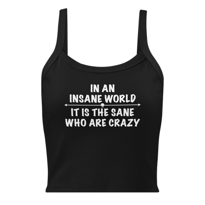 "In an insane world, it is the sane who are crazy" printed on a solid black blend women's micro-rib tanktop laying on a flat surface
