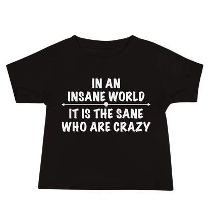 "In an insane world, it is the sane who are crazy" printed on a black baby jersey short sleeve tee laying on a flat surface