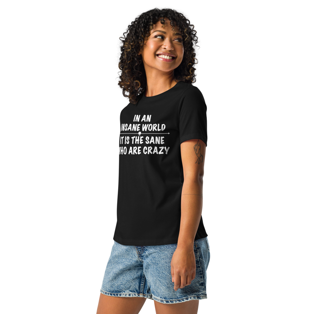 "In an insane world, it is the sane who are crazy" printed on a black women's relaxed t-shirt worn by a female
