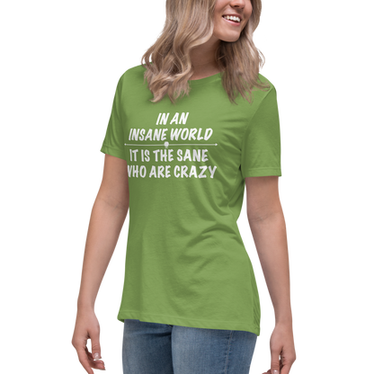 "In an insane world, it is the sane who are crazy" printed on a leaf women's relaxed t-shirt worn by a female