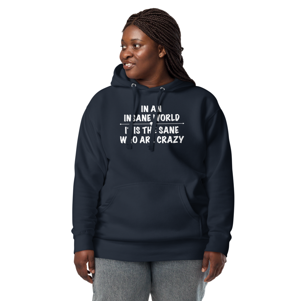 "In an insane world, it is the sane who are crazy" printed on a navy blazer unisex hoodie worn by a female