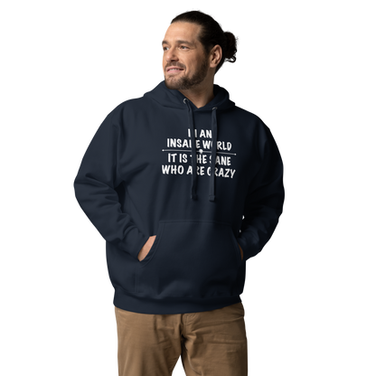 "In an insane world, it is the sane who are crazy" printed on a navy blazer unisex hoodie worn by a male