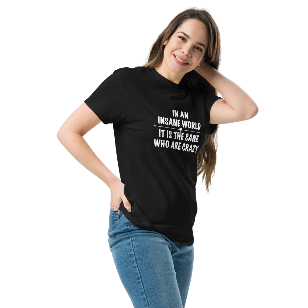 "In an insane world, it is the sane who are crazy" printed on a black unisex classic tee worn by a female
