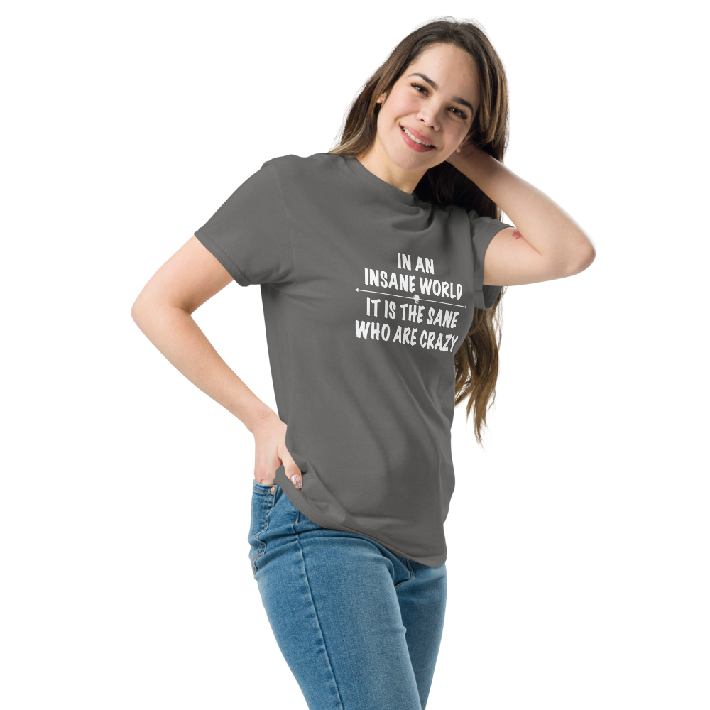 "In an insane world, it is the sane who are crazy" printed on a charcoal unisex classic tee worn by a female