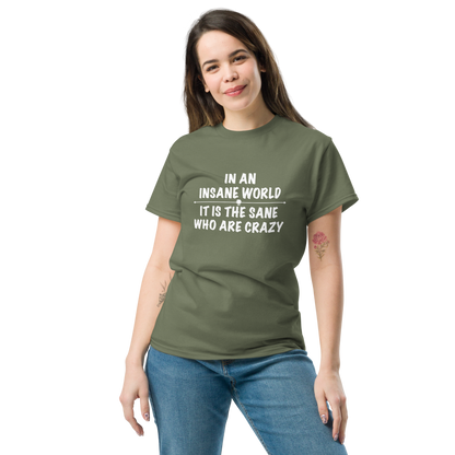 "In an insane world, it is the sane who are crazy" printed on a military green unisex classic tee worn by a female