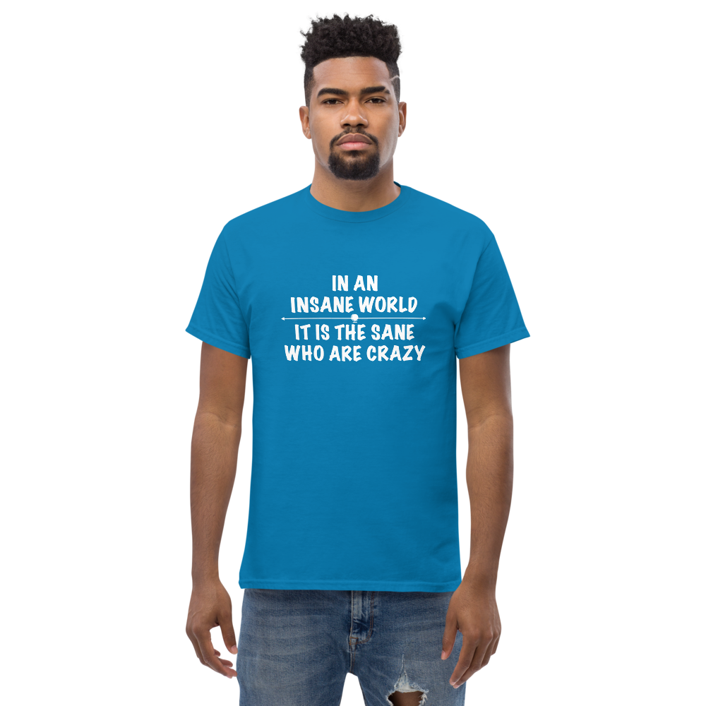 "In an insane world, it is the sane who are crazy" printed on a sapphire unisex classic tee worn by a male