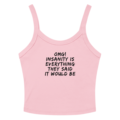 "OMG! Insanity is everything they said it would be" printed on a solid pink blend women's micro-rib tanktop laying on a flat surface amongst sunglasses and shorts