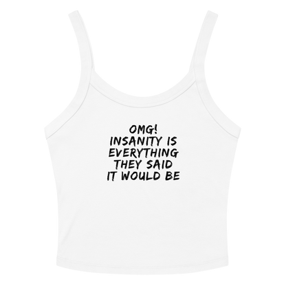 "OMG! Insanity is everything they said it would be" printed on a solid white blend women's micro-rib tanktop laying on a flat surface amongst sunglasses and shorts