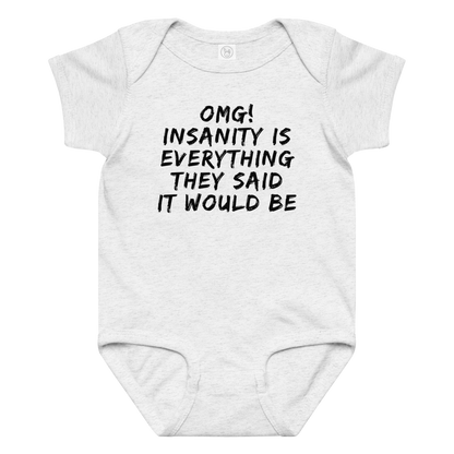 "OMG! Insanity is everything they said it would be" printed on a ash baby jersey bodysuit laying on a flat surface amongst other clothes