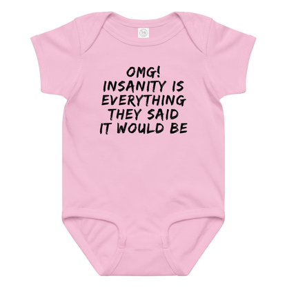 "OMG! Insanity is everything they said it would be" printed on a pink baby jersey bodysuit laying on a flat surface amongst other clothes