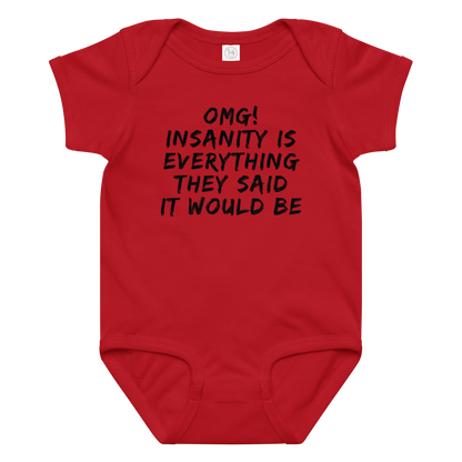 "OMG! Insanity is everything they said it would be" printed on a red baby jersey bodysuit laying on a flat surface amongst other clothes