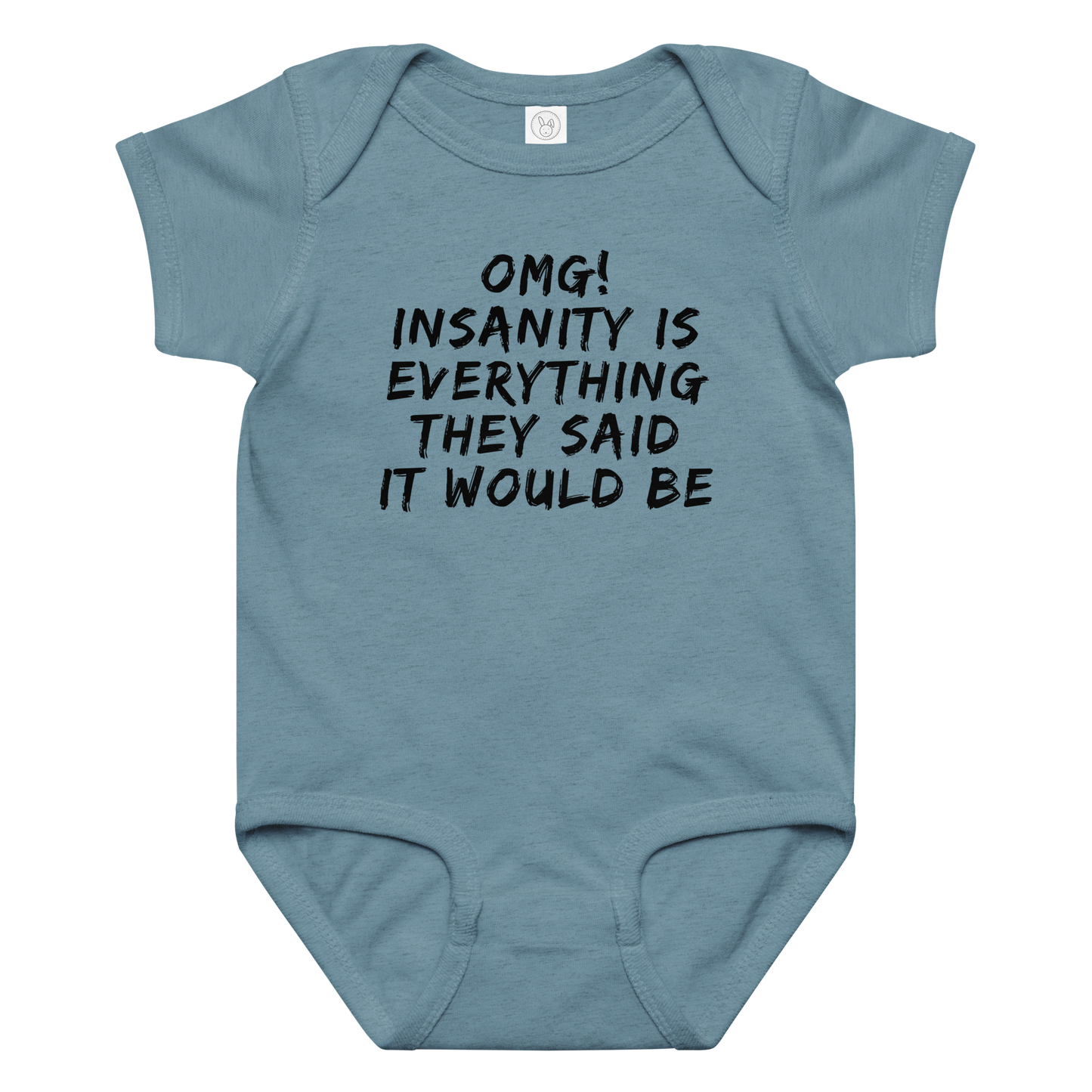 "OMG! Insanity is everything they said it would be" printed on a vintage indigo baby jersey bodysuit laying on a flat surface amongst other clothes