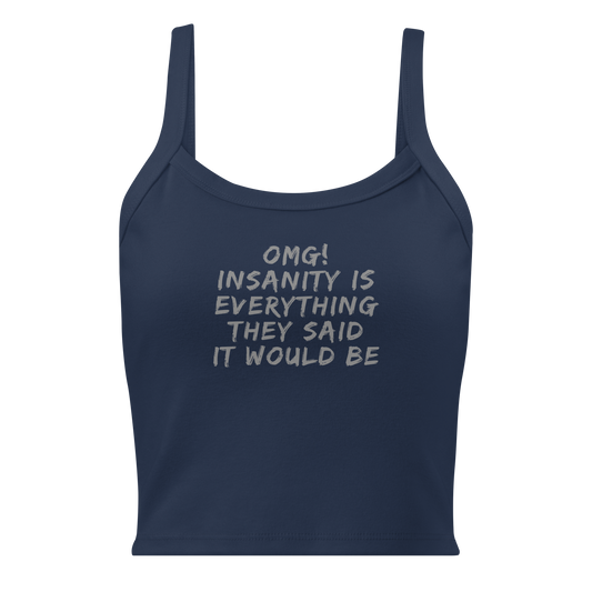 "OMG! Insanity is everything they said it would be" printed on a solid navy blend women's micro-rib tanktop laying on a flat surface