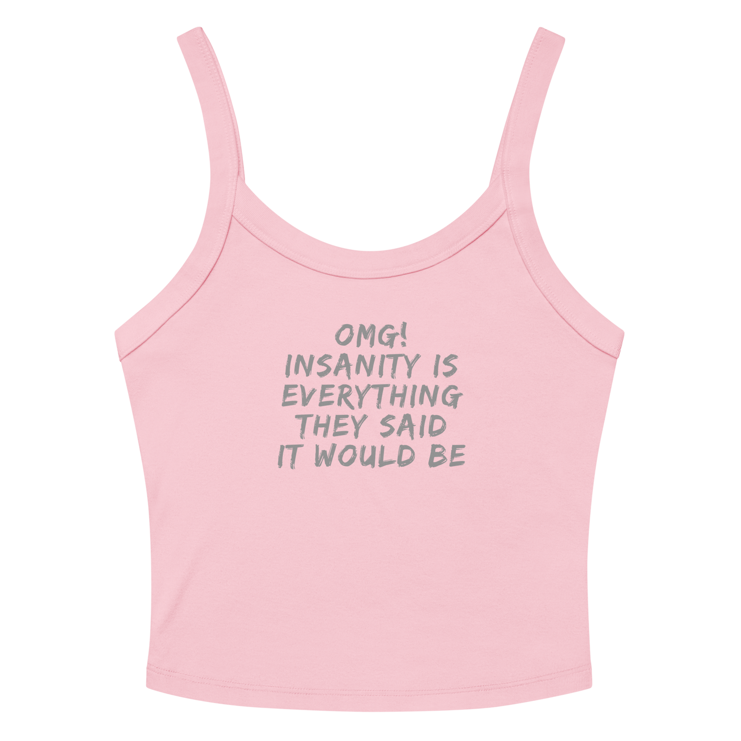 "OMG! Insanity is everything they said it would be" printed on a solid pink blend women's micro-rib tanktop laying on a flat surface amongst sunglasses and shorts