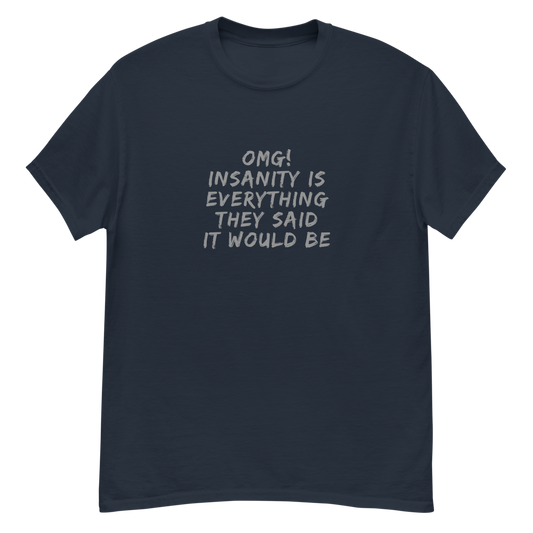 "OMG! Insanity is everything they said it would be" printed on a navy unisex classic tee laying on a flat surface