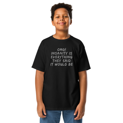 "OMG! Insanity is everything they said it would be" printed on a black youth classic tee worn by a male
