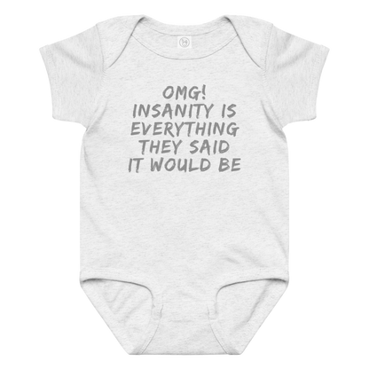 "OMG! Insanity is everything they said it would be" printed on a ash baby jersey bodysuit laying on a flat surface amongst other clothes