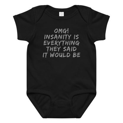 "OMG! Insanity is everything they said it would be" printed on a black baby jersey bodysuit laying on a flat surface amongst other clothes