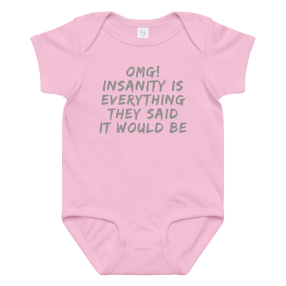 "OMG! Insanity is everything they said it would be" printed on a pink baby jersey bodysuit laying on a flat surface amongst other clothes