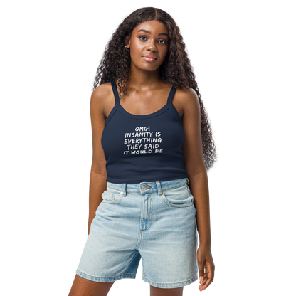 "OMG! Insanity is everything they said it would be" printed on a solid navy blend women's micro-rib tanktop worn by a female