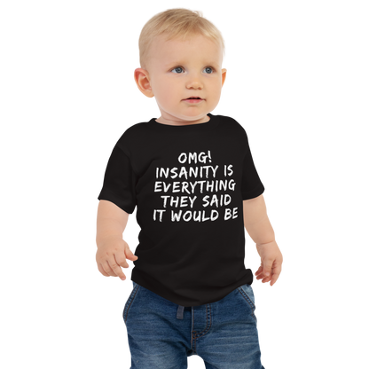 "OMG! Insanity is everything they said it would be" printed on a black baby jersey short sleeve tee worn by a male