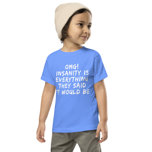 "OMG! Insanity is everything they said it would be" printed on a heather columbia blue toddler short sleeve tee worn by a male wearing a cap