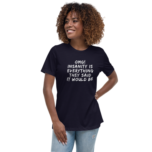 "OMG! Insanity is everything they said it would be" printed on a navy women's relaxed t-shirt worn by a female