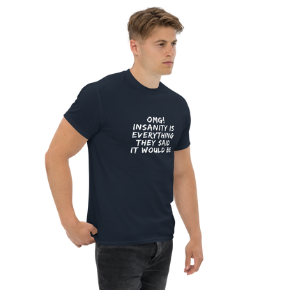 "OMG! Insanity is everything they said it would be" printed on a navy unisex classic tee worn by a male