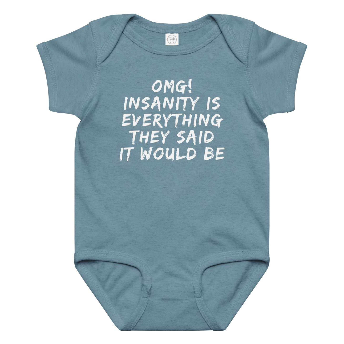 "OMG! Insanity is everything they said it would be" printed on a vintage indigo baby jersey bodysuit laying on a flat surface amongst other clothes