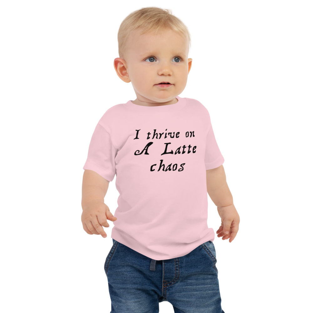 "I thrive on a latte chaos" printed on a pink baby jersey short sleeve tee worn by a male