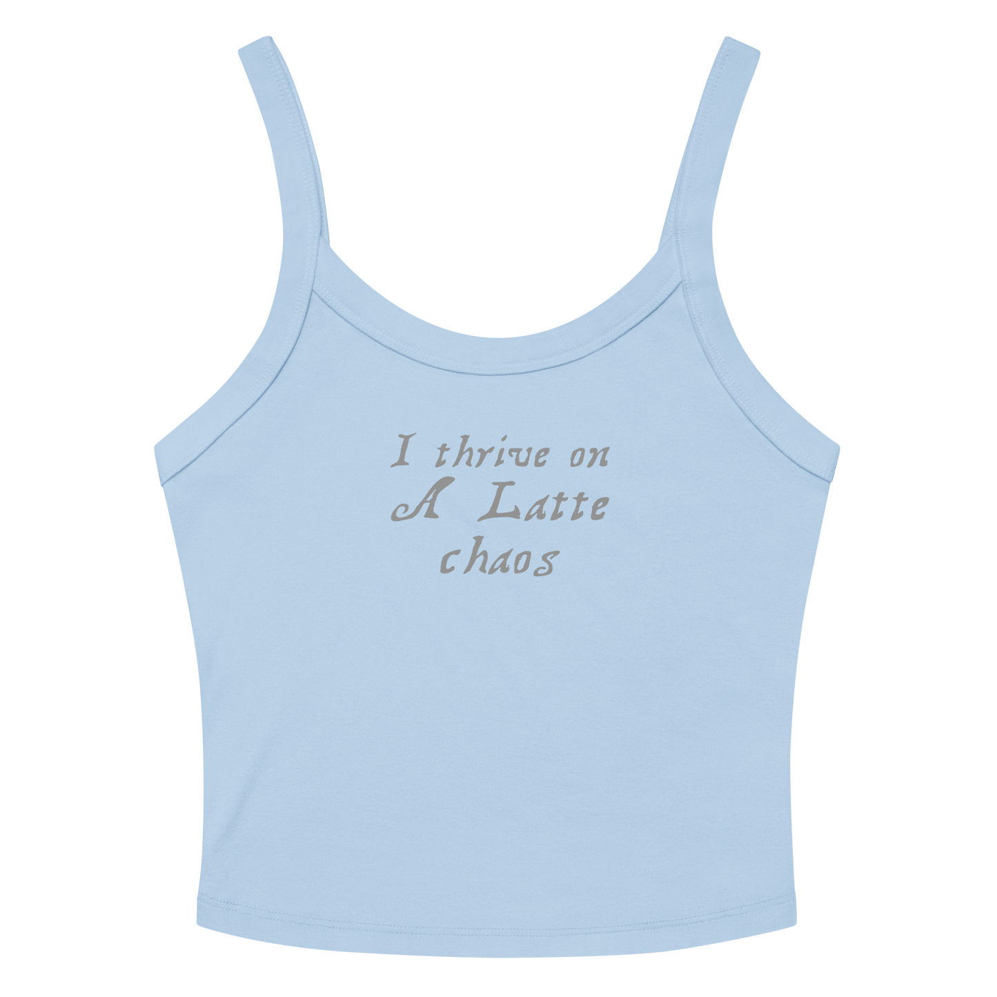 "I thrive on a latte chaos" printed on a solid baby blue blend women's micro-rib tanktop laying on a flat surface amongst sunglasses and shorts