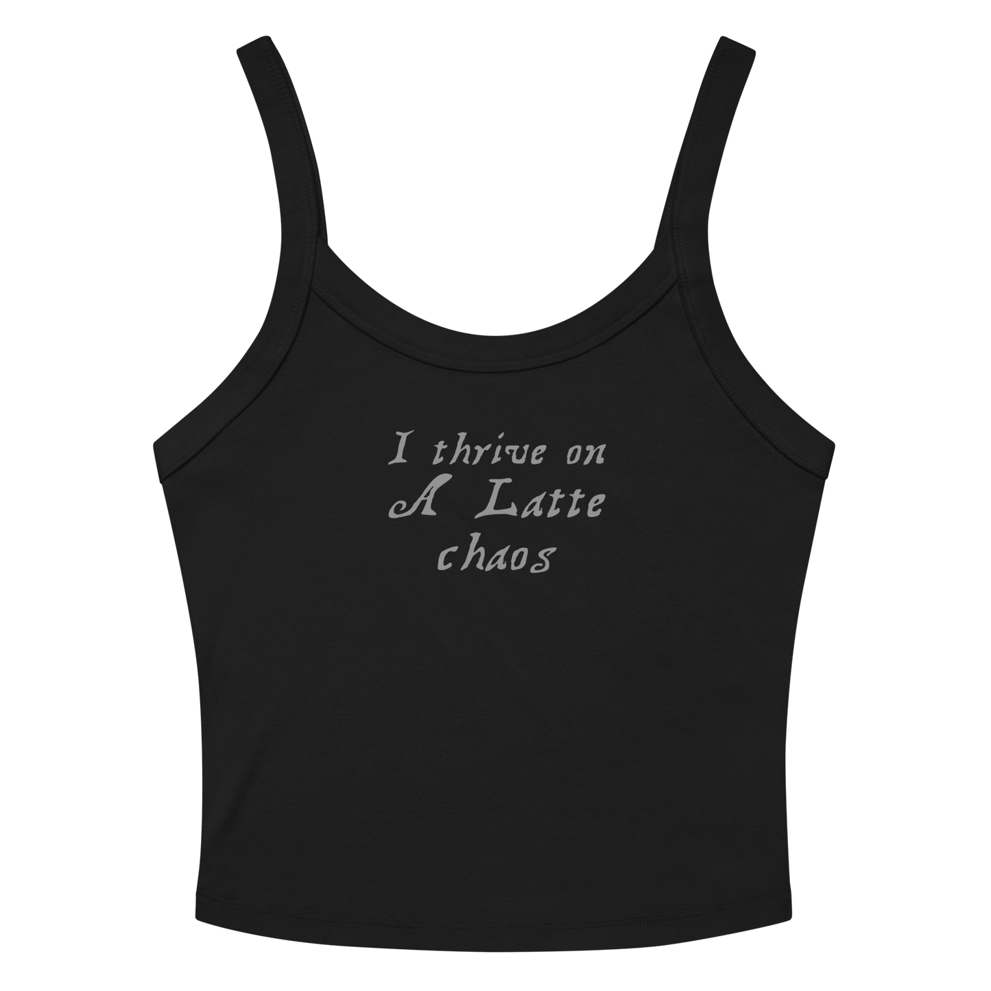 "I thrive on a latte chaos" printed on a solid black blend women's micro-rib tanktop laying on a flat surface amongst sunglasses and shorts