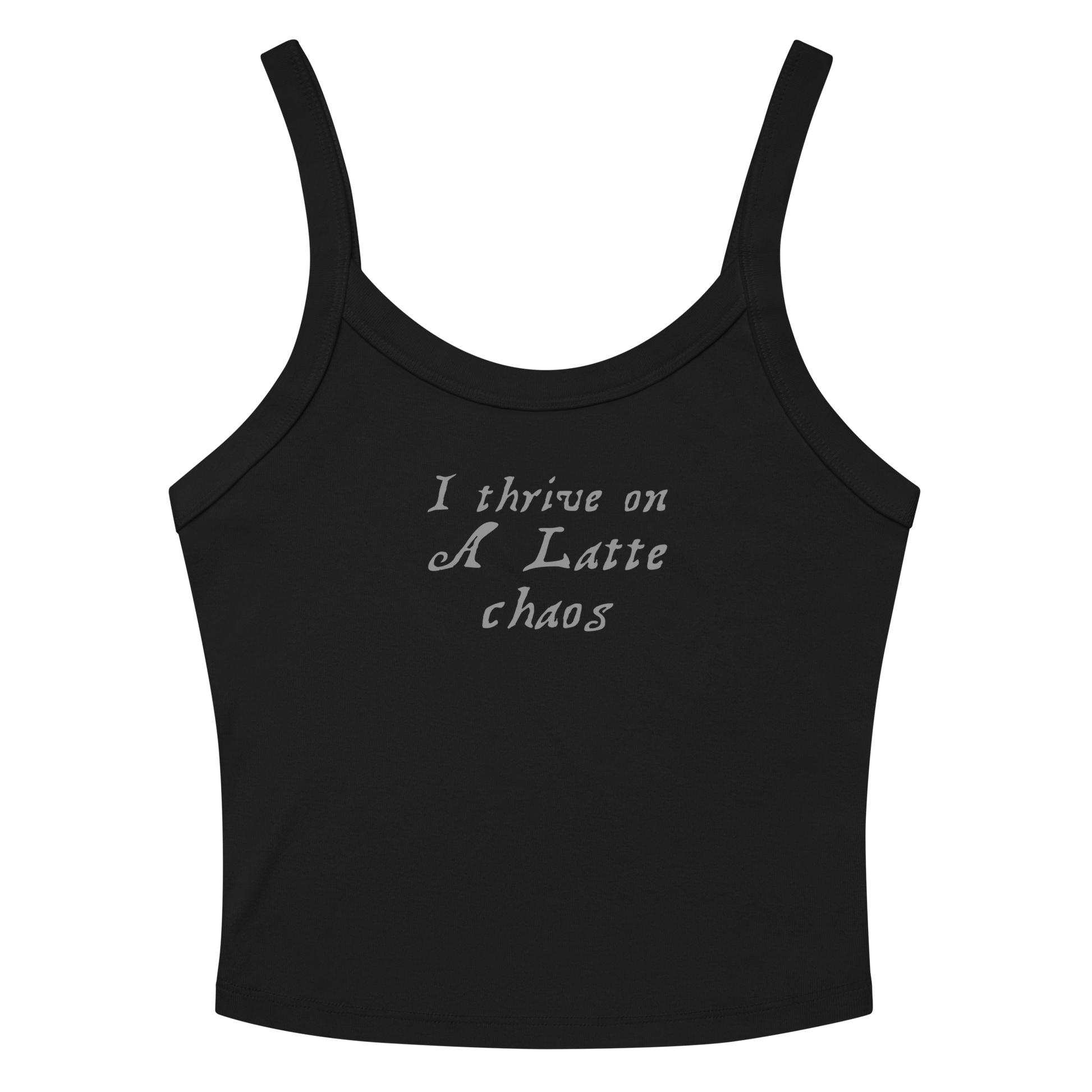 "I thrive on a latte chaos" printed on a solid black blend women's micro-rib tanktop laying on a flat surface amongst sunglasses and shorts