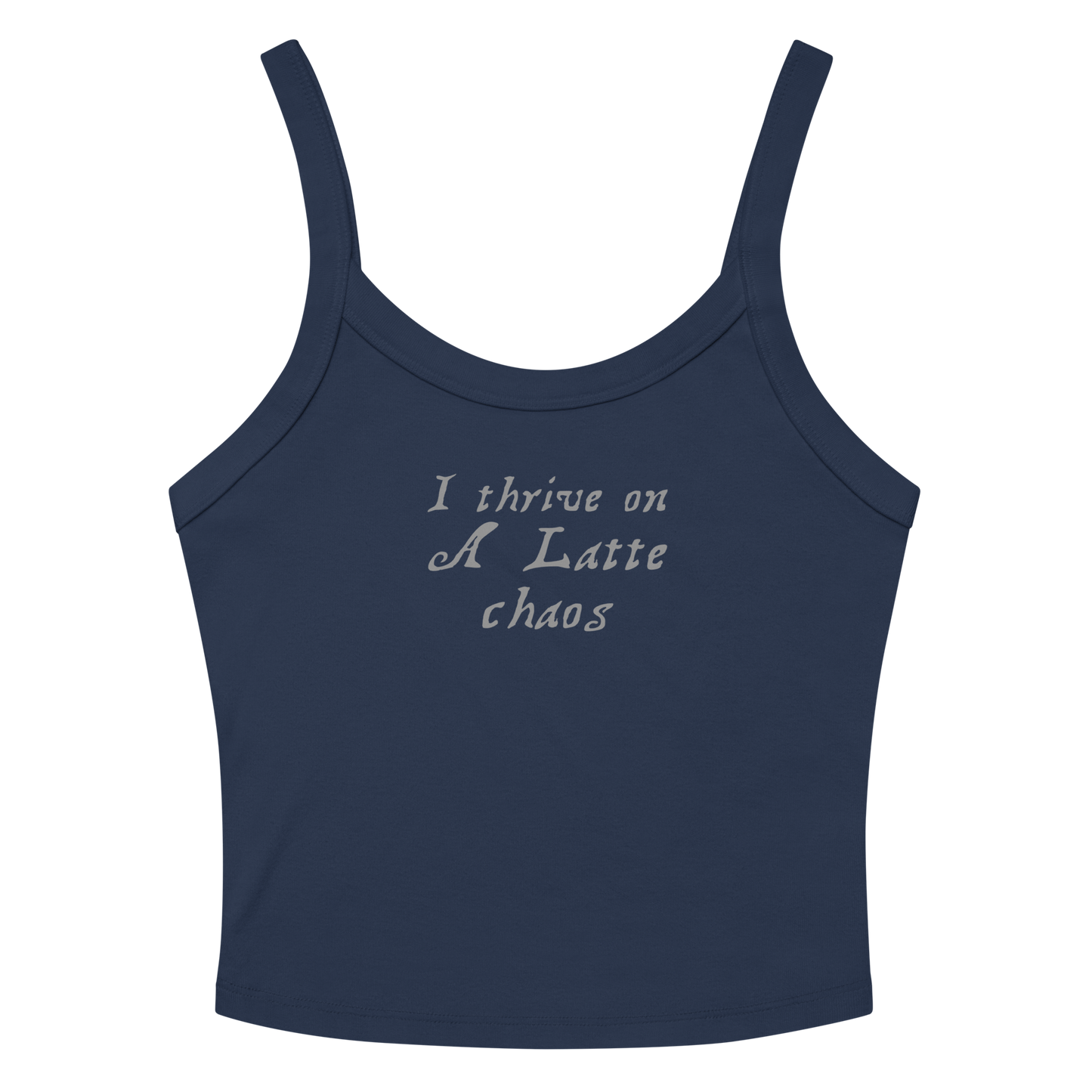 "I thrive on a latte chaos" printed on a solid navy blend women's micro-rib tanktop laying on a flat surface amongst sunglasses and shorts