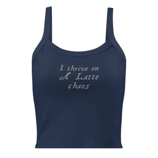 "I thrive on a latte chaos" printed on a solid navy blend women's micro-rib tanktop laying on a flat surface