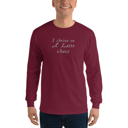 "I thrive on a latte chaos" printed on a maroon men's long sleeve shirt worn by a male