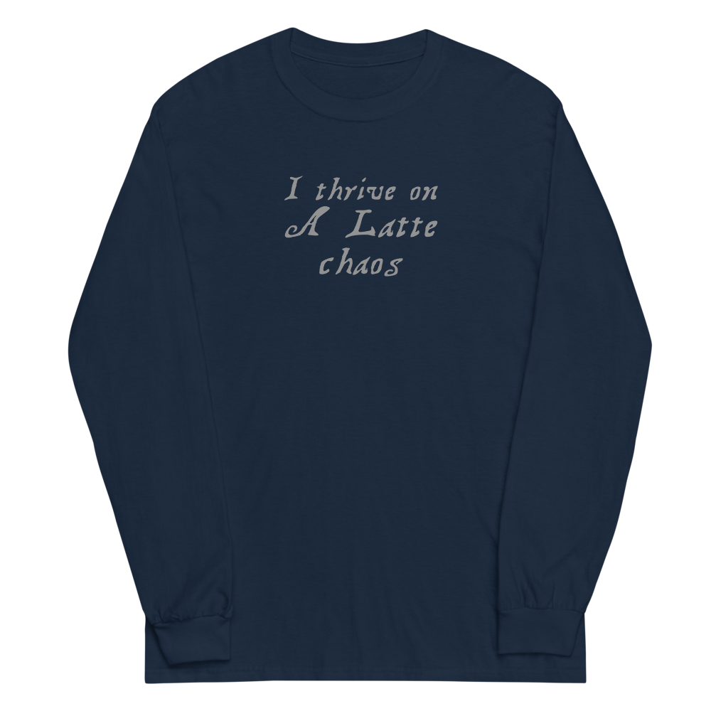 "I thrive on a latte chaos" printed on a navy men's long sleeve shirt laying on a flat surface