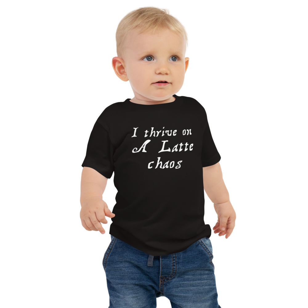 "I thrive on a latte chaos" printed on a black baby jersey short sleeve tee worn by a male